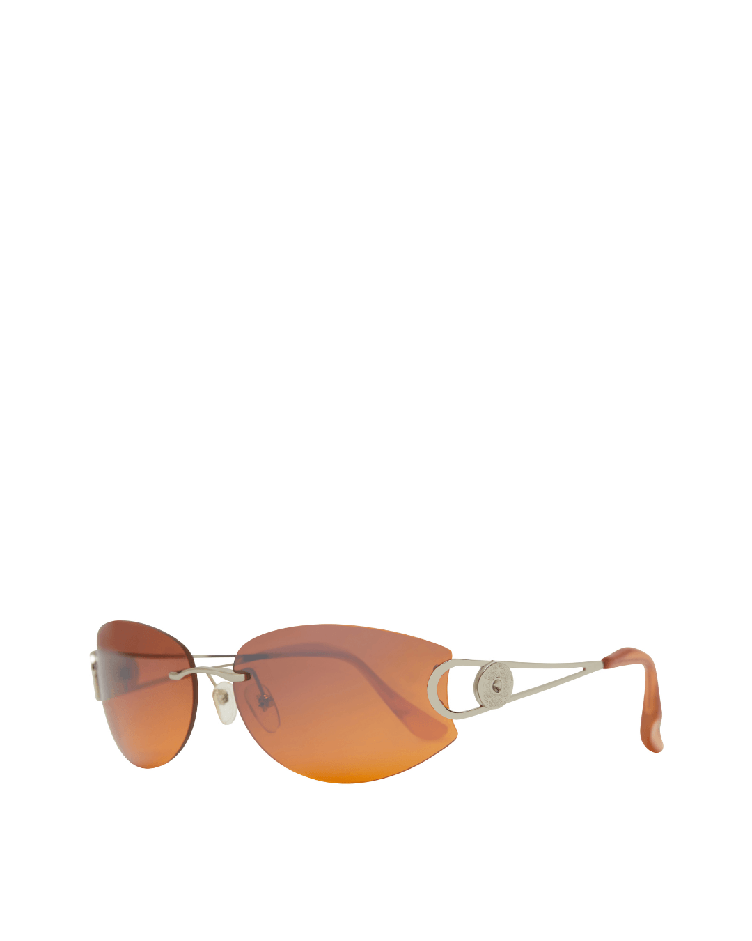 Rimless sunglasses with orange gradient lenses and thin metal arms on a white background.