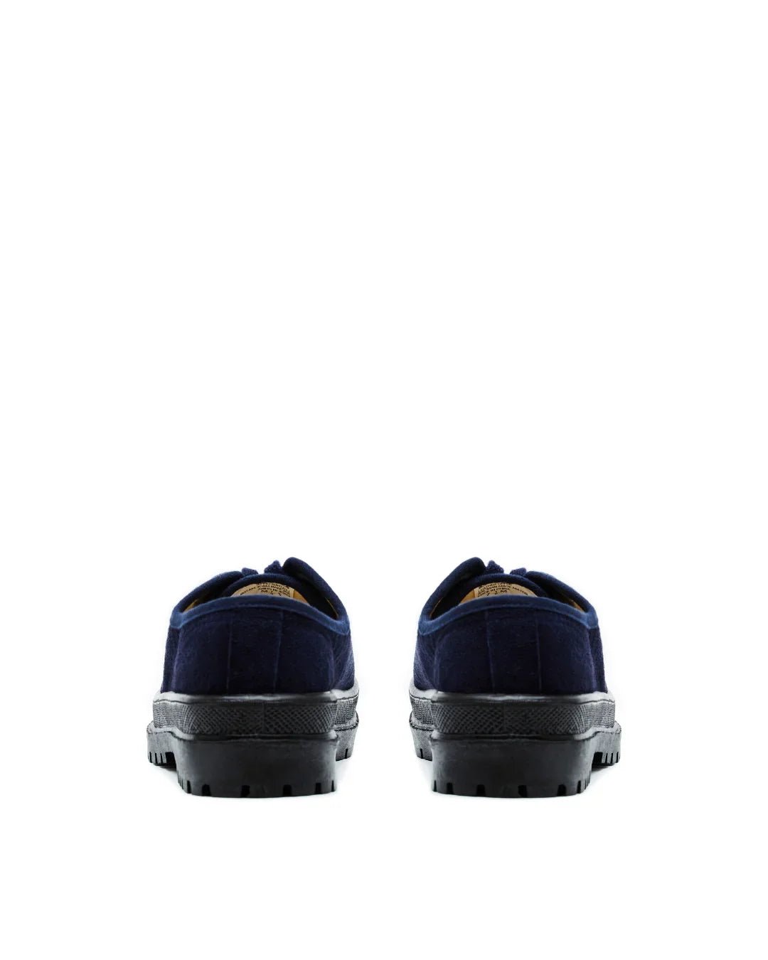 pair of navy blue suede low-top sneakers with black rubber soles on white background