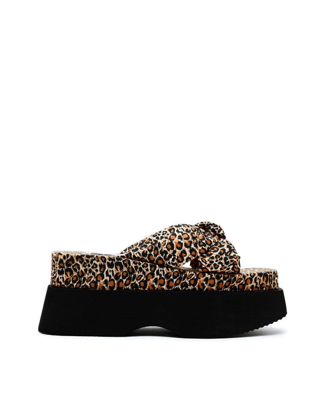 leopard print platform slide sandal with thick black sole on a white background