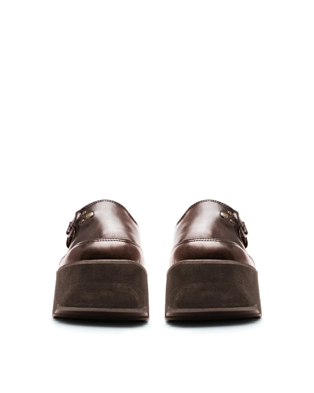 brown platform clogs with buckle detail and thick soles on a white background