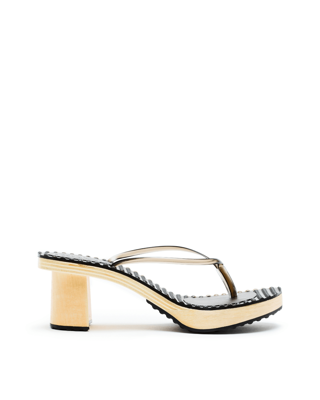 Black platform sandal with clear straps, ridged sole, and light wood heel on white background
