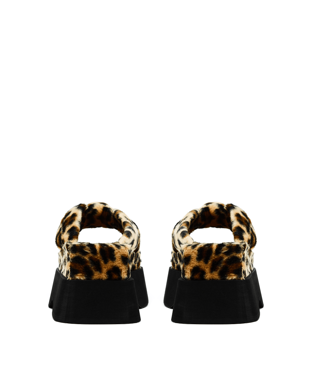 pair of leopard print faux fur platform slide sandals with black soles on white background