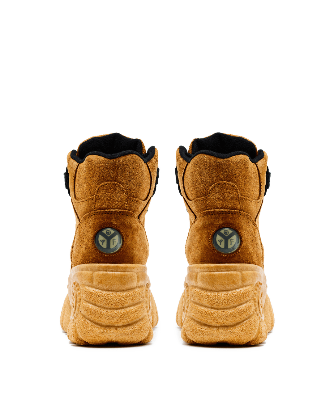 Pair of brown suede platform sneakers with thick textured soles, shown from the back on a white background.