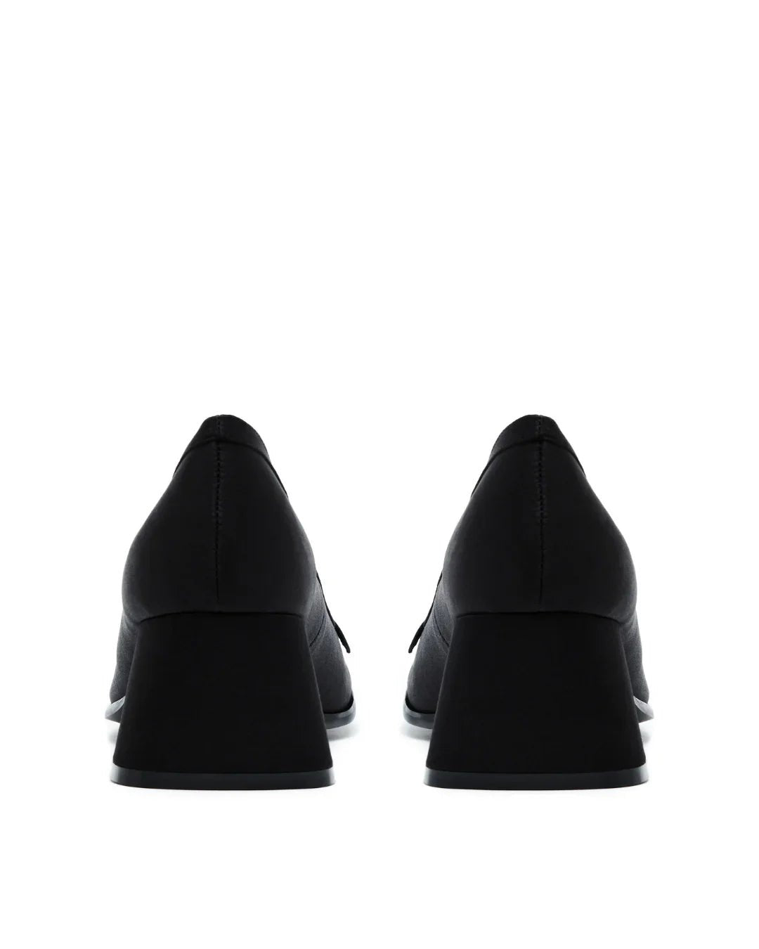 Pair of black satin block heel pumps shown from the back on a white background