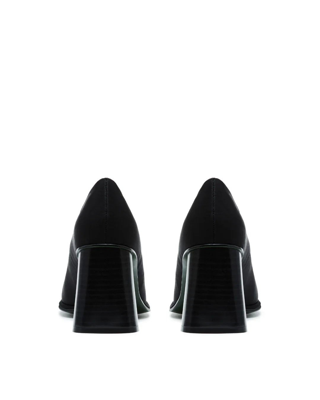 pair of black nylon block heel pumps viewed from the back on white background