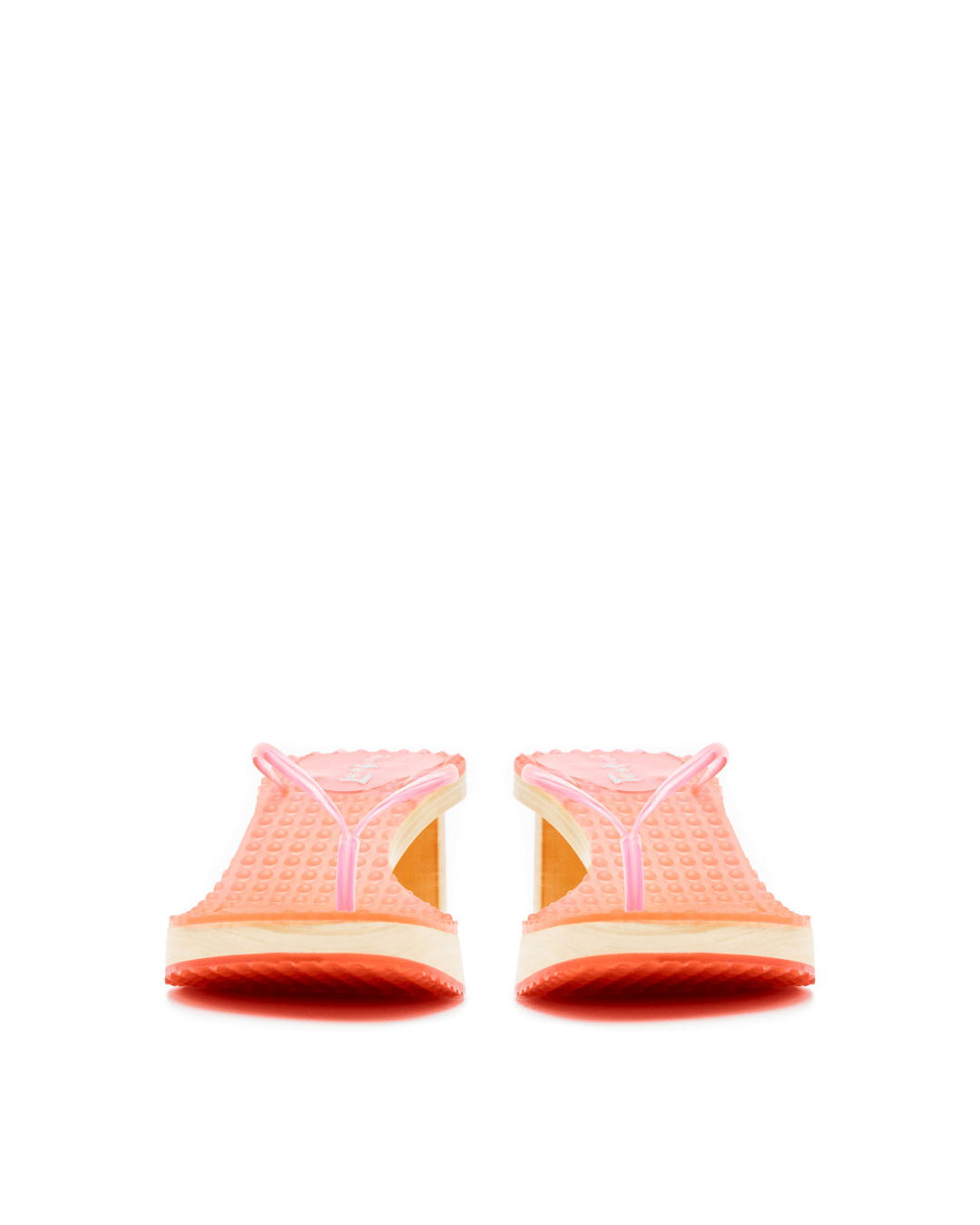 Pair of pink platform sandals with textured rubber soles on a white background