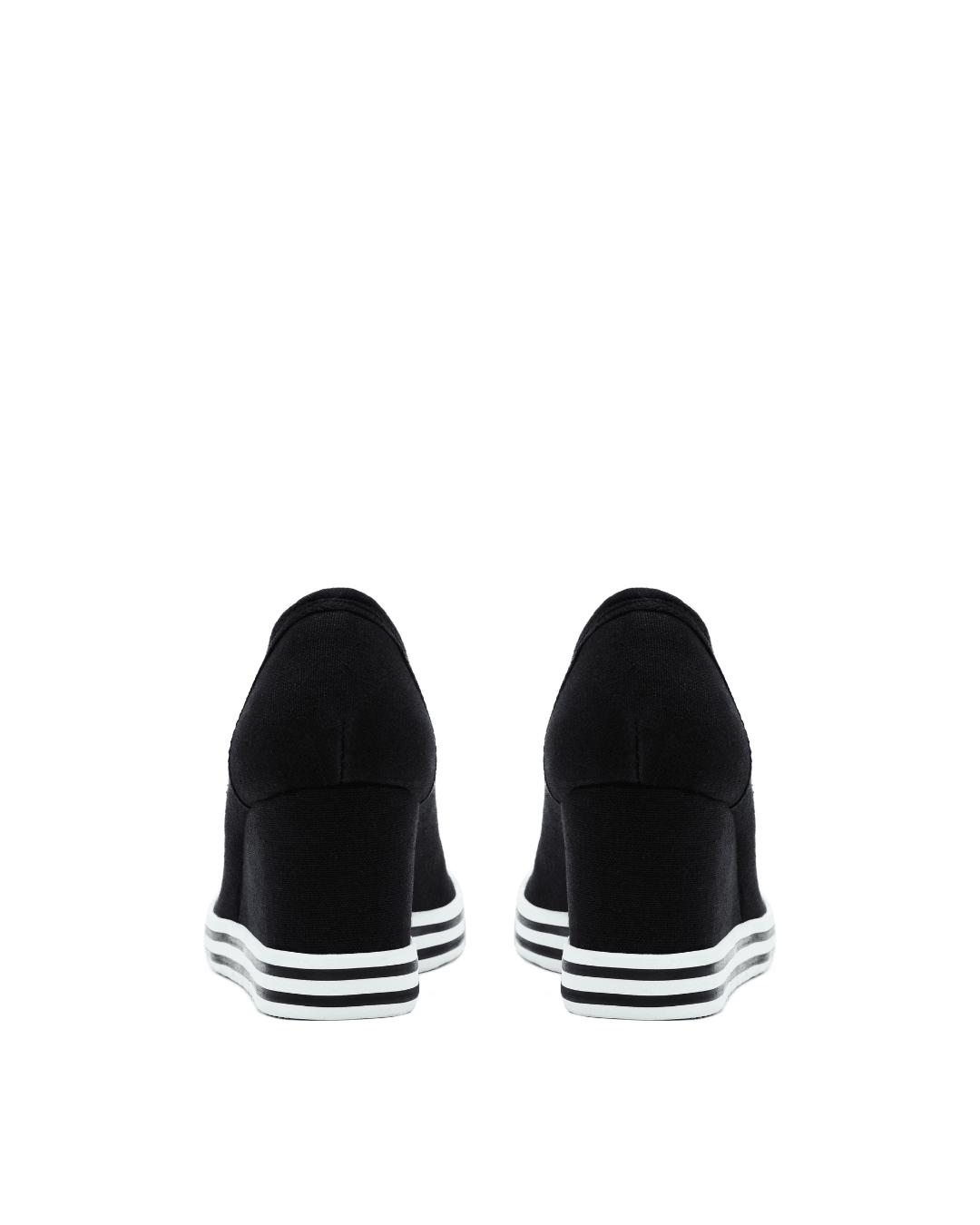 Black canvas platform sneakers with block heels and white striped rubber soles, rear view