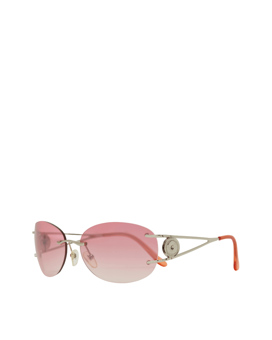 Rimless sunglasses with pink gradient lenses and silver metal arms on a white background