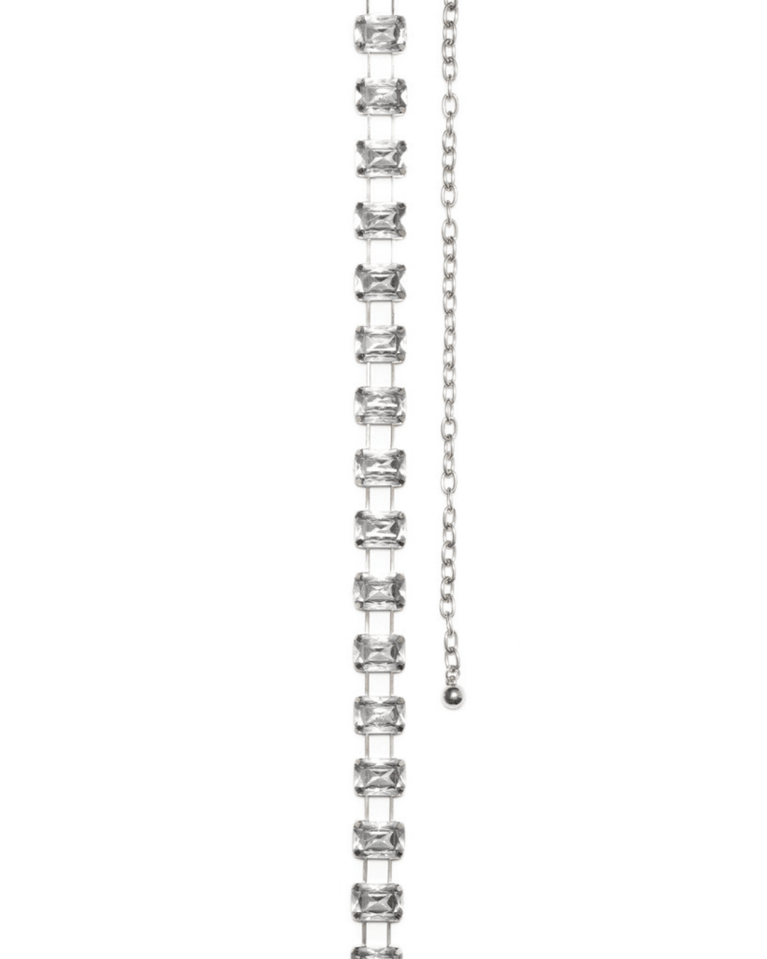 clear jeweled belt with rectangular stones and silver chain on white background
