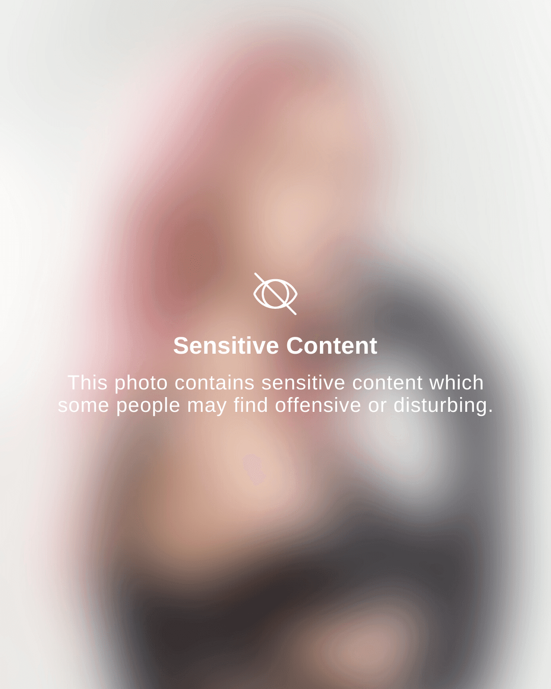 Gold-tone metal hoop earrings with double hoop design on white background