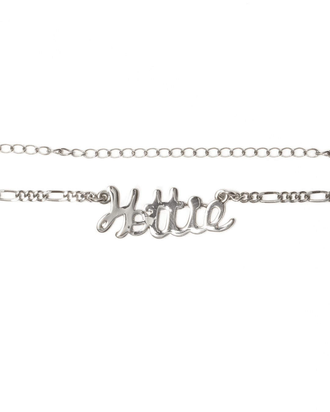Silver body chain with script pendant reading 'Hottie' on a white background
