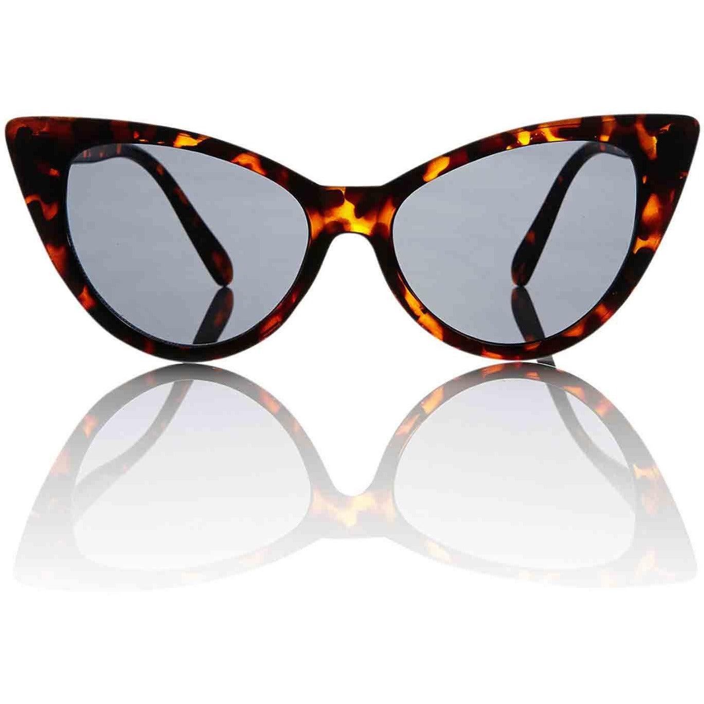 Tortoiseshell cat eye sunglasses with dark lenses on a white reflective surface.