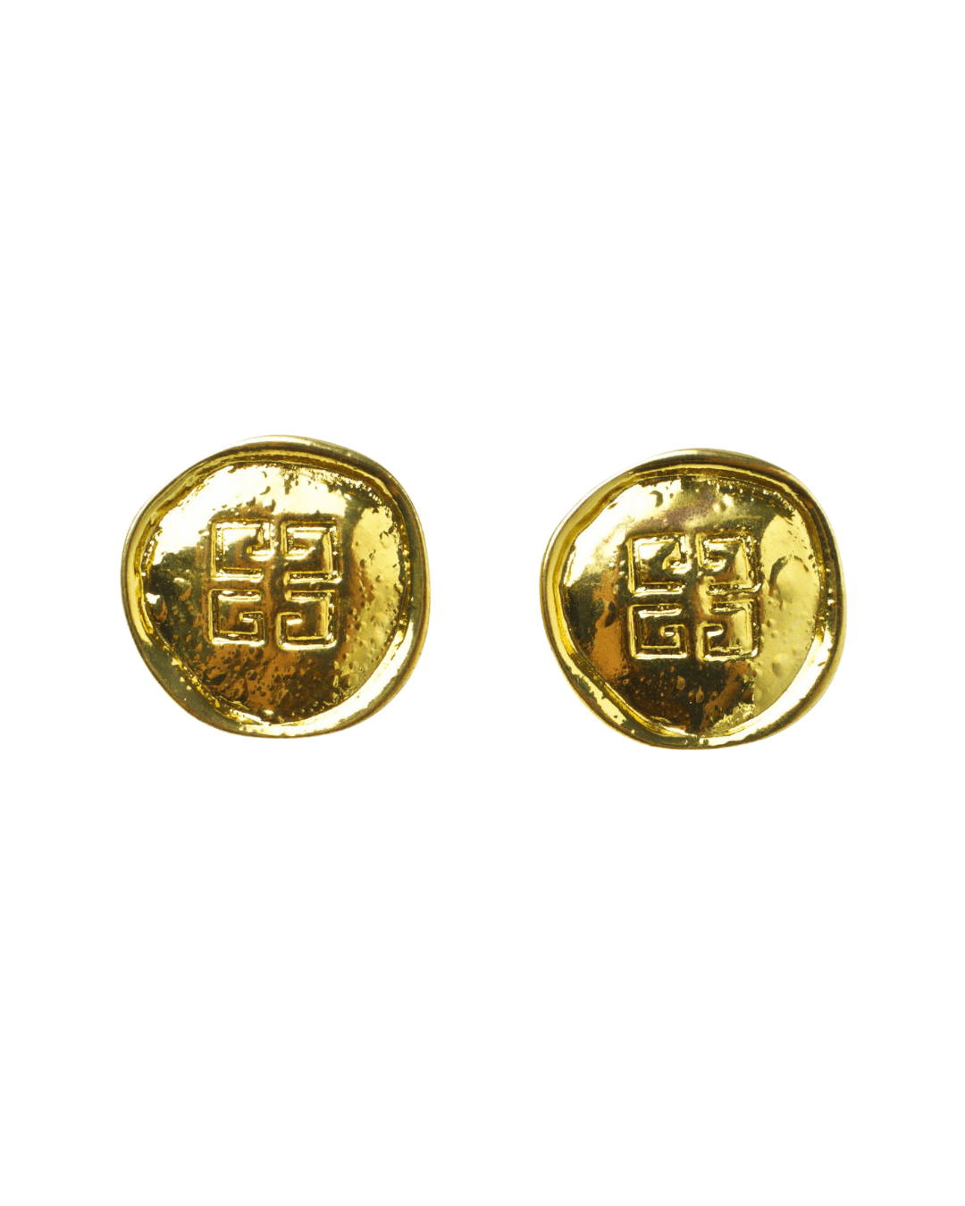 pair of round gold coin-shaped metal earrings with geometric embossed design on white background