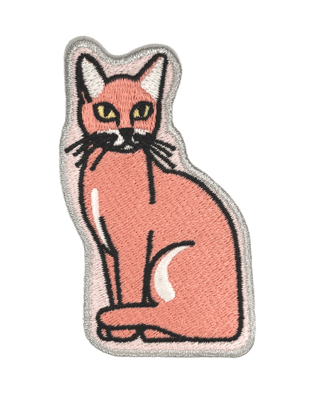 peach colored embroidered cat patch with black and white details on white background